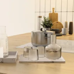 Minimalistyczna aranżacja blatu kuchennego z drewnianym wykończeniem, naczyniami i dekoracyjnymi butelkami na tle białych płytek w pionowym układzie.