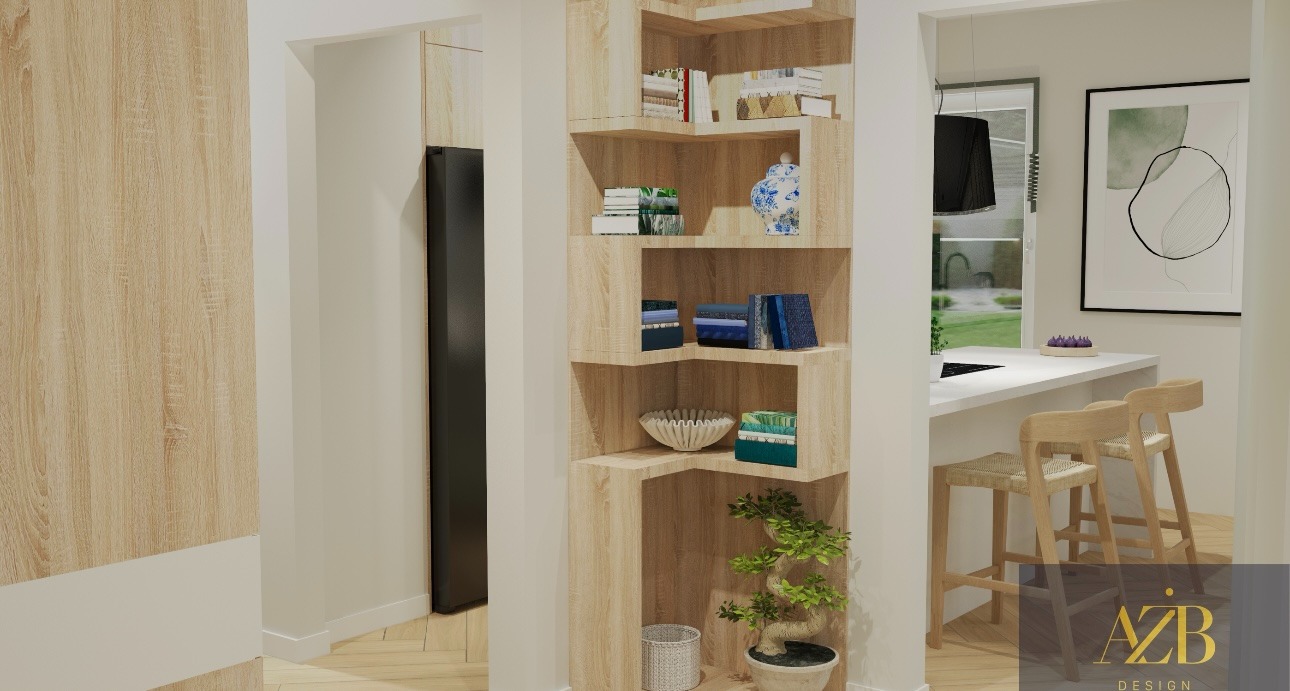 Drewniana półka narożna z dekoracjami, widok na kuchnię z białym blatem i hokerami, minimalistyczny obraz na ścianie, nowoczesne wnętrze.