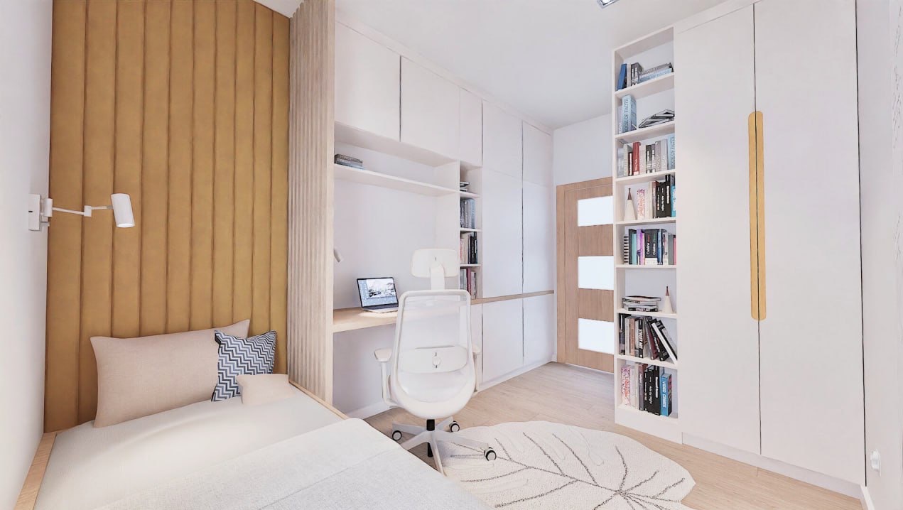 Jasne wnętrze pokoju z miejscem do spania i pracy: łóżko z panelem ściennym, biurko z laptopem, białe szafy i regał na książki tworzą spójną całość.