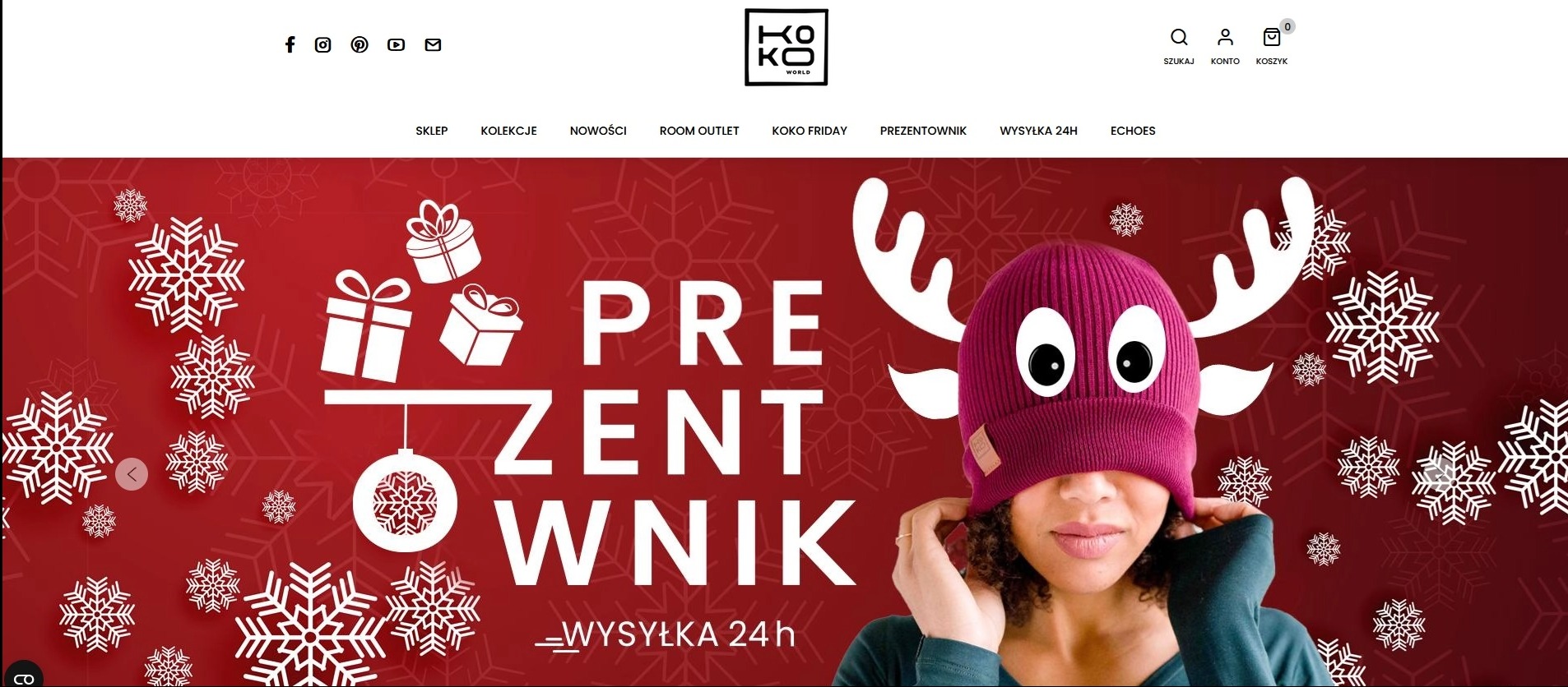 Strona sklepu KOKOworld z motywem świątecznym i hasłem 'Prezentownik', prezentująca czapkę z rogami renifera na modelce. Czerwone tło z śnieżynkami i prezentami.