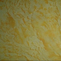 Ekipa malarska - Dekoracyjna, wypukła struktura ściany w odcieniach ciepłego beżu i złota, przypominająca abstrakcyjny pejzaż. Efektowna faktura na ścianie w pokoju.