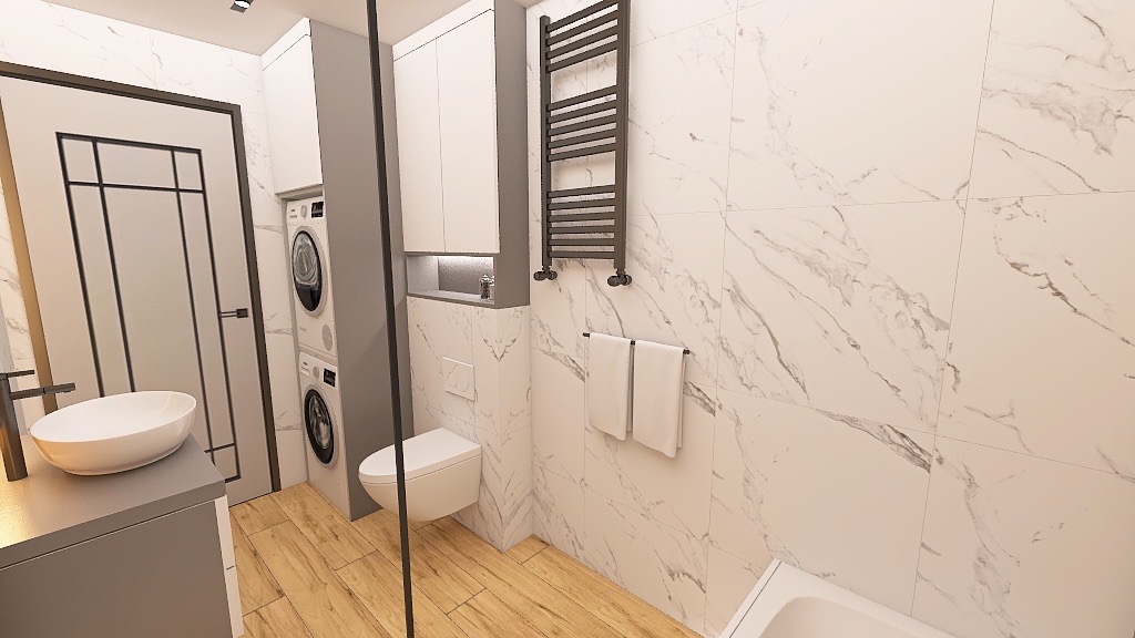 Nowoczesna łazienka z marmurowymi płytkami, drewnianą podłogą, podwieszaną toaletą i grzejnikiem drabinkowym. Widoczna pralka w zabudowie i umywalka nablatowa.