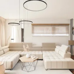 Jasny salon z narożnikiem, drewnianym stołem i krzesłami. Okrągłe lampy wiszące, drewniane żaluzje i dekoracje ścian dodają elegancji.