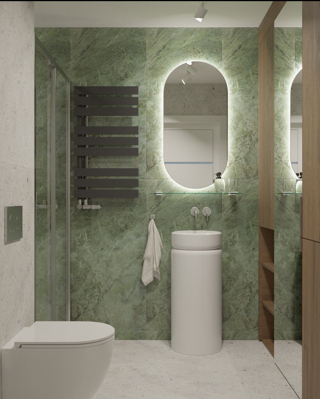 Nowoczesna łazienka z zielonymi marmurowymi płytkami, owalnym lustrem z podświetleniem LED i białą, cylindryczną umywalką wolnostojącą. Minimalistyczny grzejnik drabinkowy.