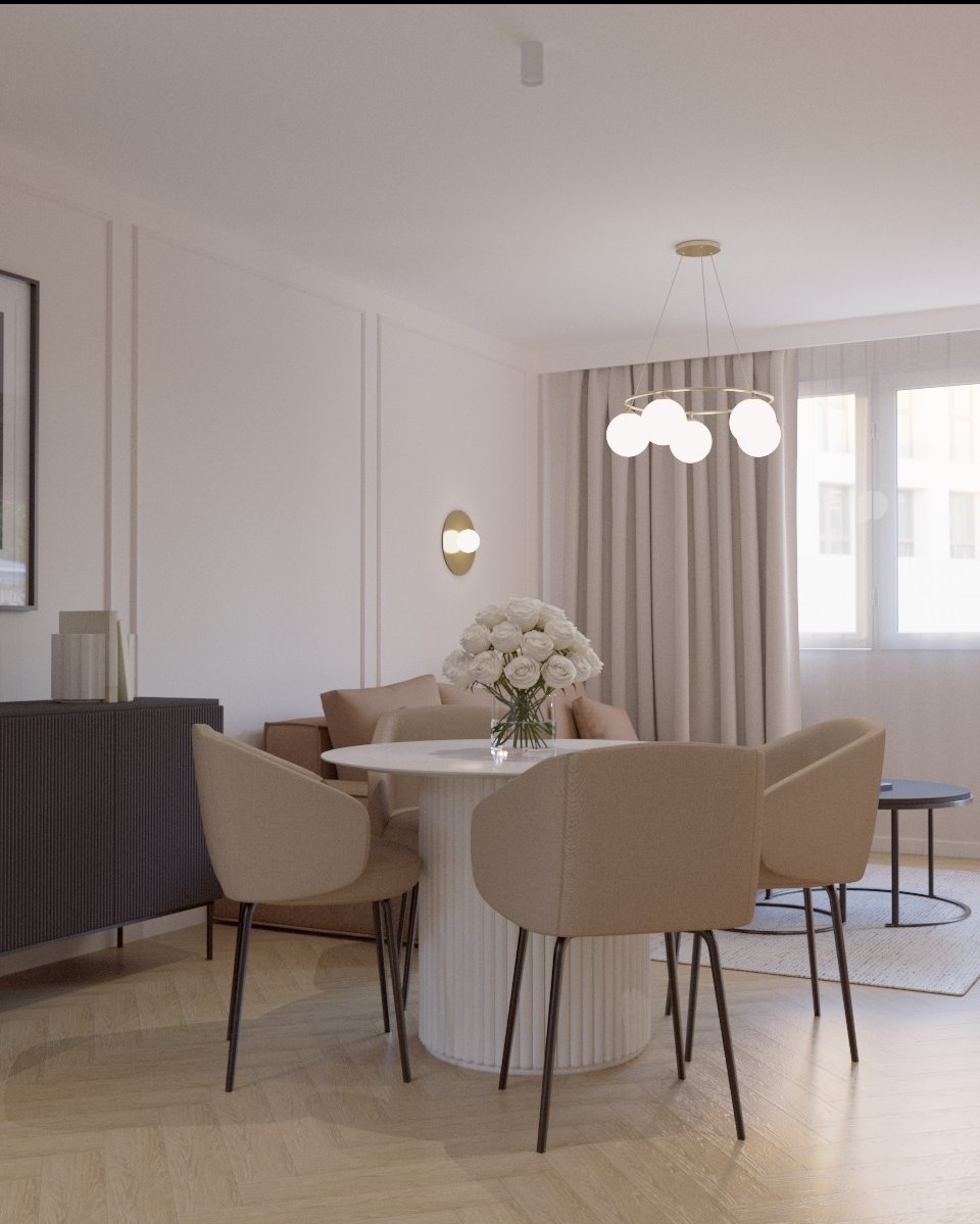 Jasne wnętrze z okrągłym stołem i beżowymi krzesłami. Dekoracyjny bukiet białych róż na stole, minimalistyczna lampa sufitowa, parkiet w jodełkę.