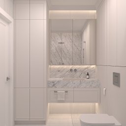 Nycz.design - Elegancka, minimalistyczna łazienka w Jawiszowicach. Białe szafki, marmurowy blat z umywalką i podświetlane lustro tworzą spójną całość.