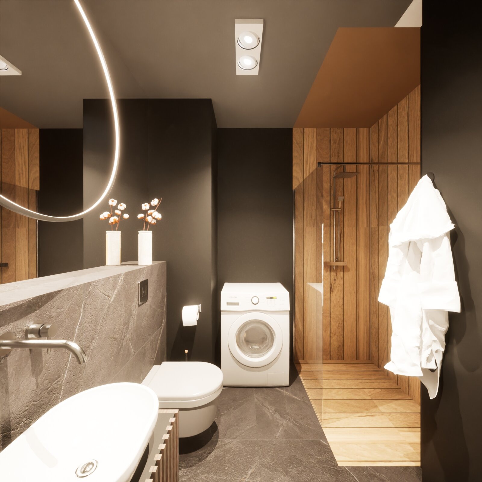 Nowoczesna łazienka z drewnianymi akcentami: kabina prysznicowa, umywalka na blacie z szarego kamienia, pralka i okrągłe lustro z podświetleniem LED.