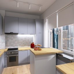 Renata Urban Projekty na 4 kąty - Jasna kuchnia w szarościach z drewnianym blatem i widokiem na miasto. Nowoczesne oświetlenie punktowe i płytki mozaikowe dodają elegancji.