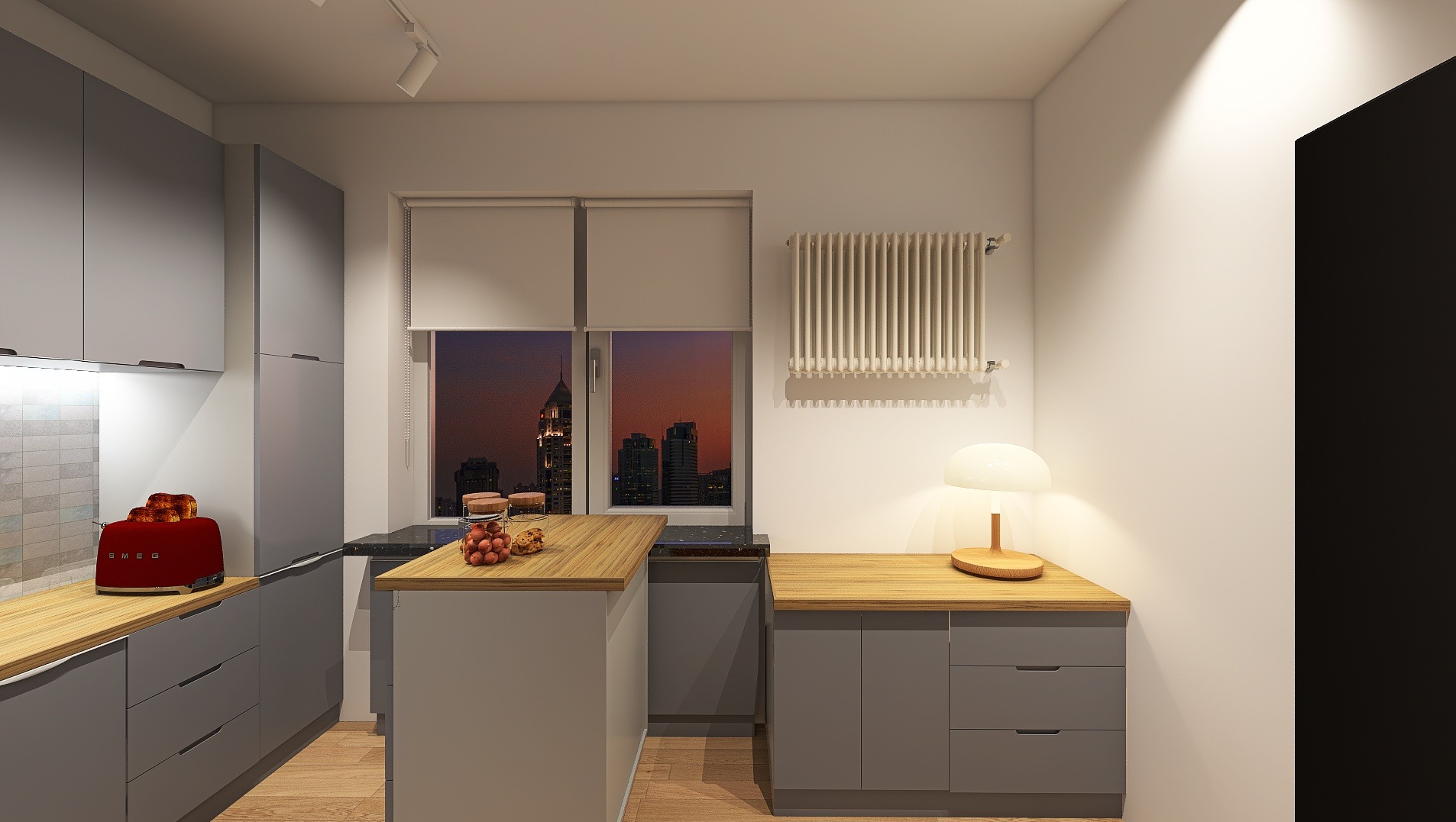Szara kuchnia z drewnianymi blatami i widokiem na miasto o zmierzchu. Czerwony toster SMEG z pieczywem na blacie. Ciepłe światło lampki stołowej.