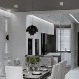 Elegancka jadalnia z widokiem na kuchnię: białe krzesła, stół z nakryciem, designerska lampa wisząca, marmurowy backsplash w kuchni. Nowoczesne wykończenie wnętrz.