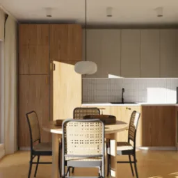 Jasna kuchnia z drewnianymi szafkami i okrągłym stołem z krzesłami z rattanowym siedziskiem. Promienie słońca wpadają przez okno.