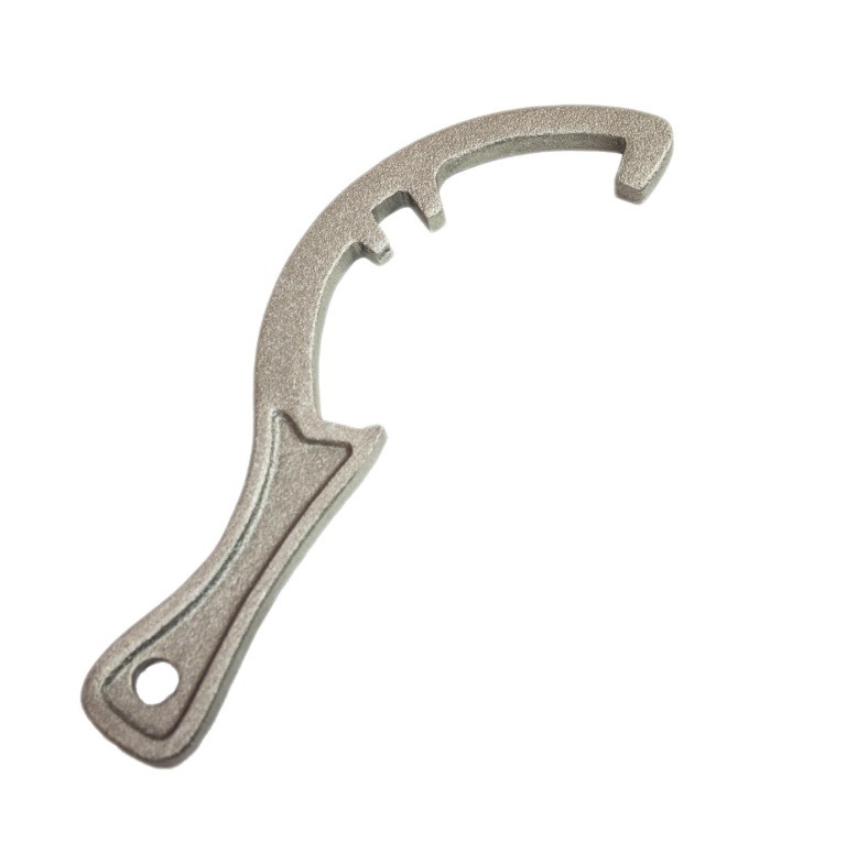Metalowy klucz hakowy o matowej powierzchni, z charakterystycznym zakrzywionym kształtem i otworem w rękojeści, na białym tle.