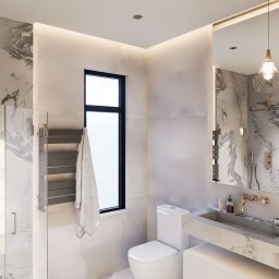 Your Hub Sp. z o.o. - Nowoczesna łazienka z marmurowym wykończeniem, prysznicem walk-in i designerską umywalką z podświetlanym lustrem.