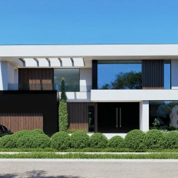 Nowoczesna willa o minimalistycznej bryle z dużymi przeszkleniami i drewnianymi detalami, której fasadę zdobi kontrast bieli i czerni.