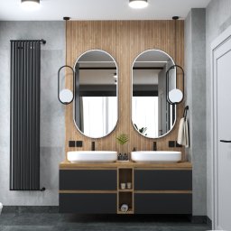 FORMA-MEBLE TOMASZ WŁÓDZIK - Nowoczesna łazienka w Chojnicach z dwoma okrągłymi lustrami nad umywalkami, grzejnikiem drabinkowym i dekoracyjnym lustrem w czarnej ramie.