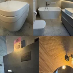 Wykończona łazienka z elementami w stylu nowoczesnym: podwieszana toaleta, wanna wolnostojąca, umywalka nablatowa i ozdobne płytki. Całość utrzymana w stonowanej kolorystyce.