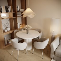Architektura Wnętrz Aleksandra Łabuda - Jasne, nowoczesne wnętrze jadalni z okrągłym stołem, czterema krzesłami i regałem na książki. Lampa wisząca w kształcie kwiatu dodaje unikalnego charakteru.