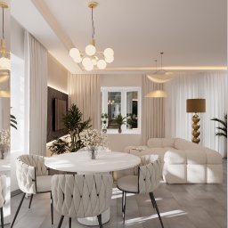 Architektura Wnętrz Aleksandra Łabuda - Jasne wnętrze: okrągły stół z krzesłami, sofa, lampy wiszące i podłogowa. Minimalistyczny design z roślinami doniczkowymi i dużym oknem. Stonowana kolorystyka.