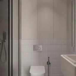 Minimalistyczna łazienka w szarościach: kabina prysznicowa z czarną ramą, podwieszana toaleta, umywalka z szafką i płytki imitujące cegłę. Nowoczesny design.