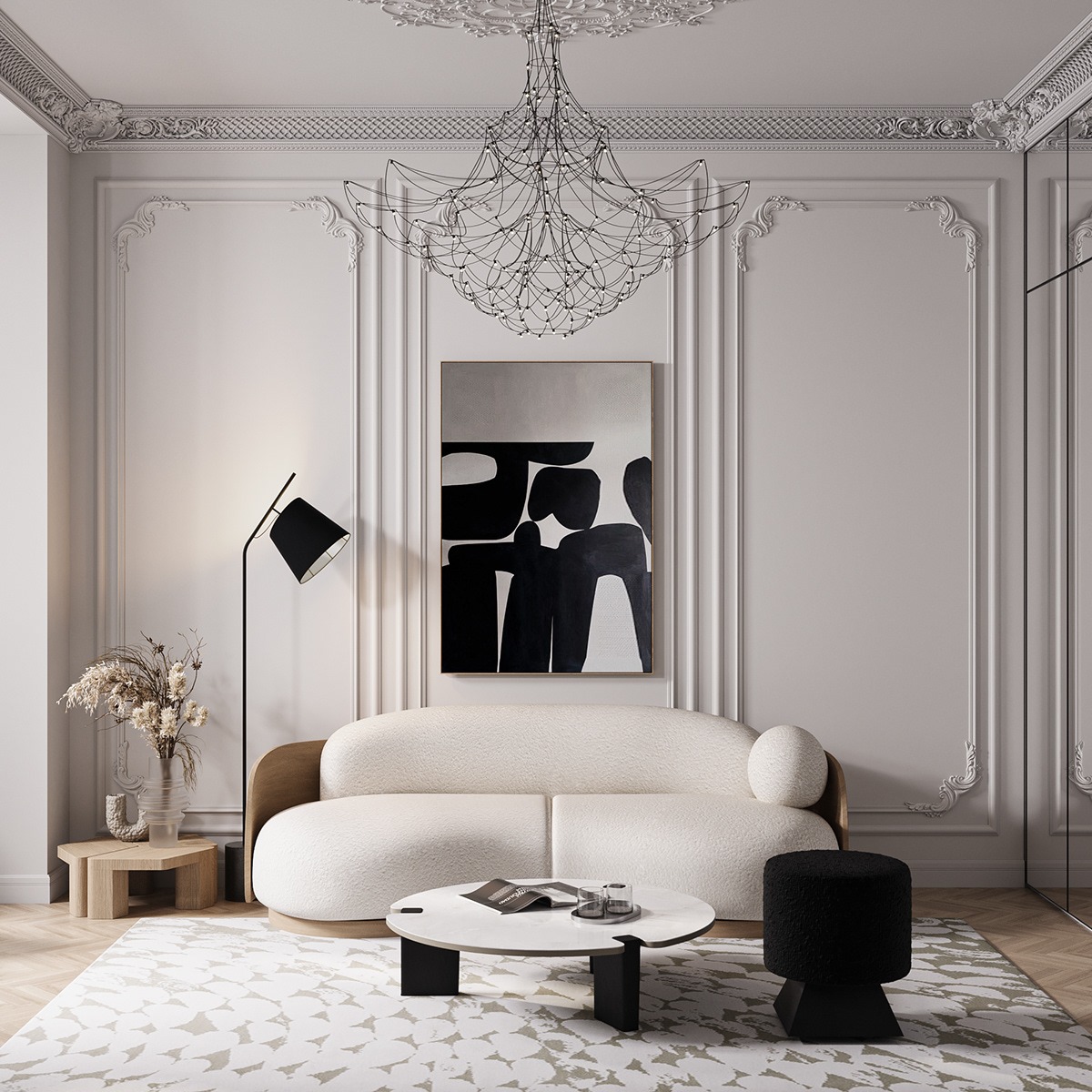 Elegancki salon z kremową sofą, abstrakcyjnym obrazem i nowoczesnym żyrandolem. Białe ściany z dekoracyjnymi sztukateriami i okrągły stolik kawowy dodają wnętrzu szyku.