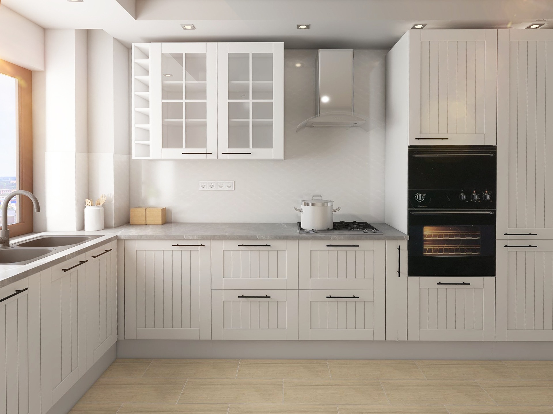 Jasna kuchnia w stylu rustykalnym: białe szafki z frezowanymi frontami, ciemne uchwyty, okno z widokiem na miasto. Na blacie kuchenka i garnek.