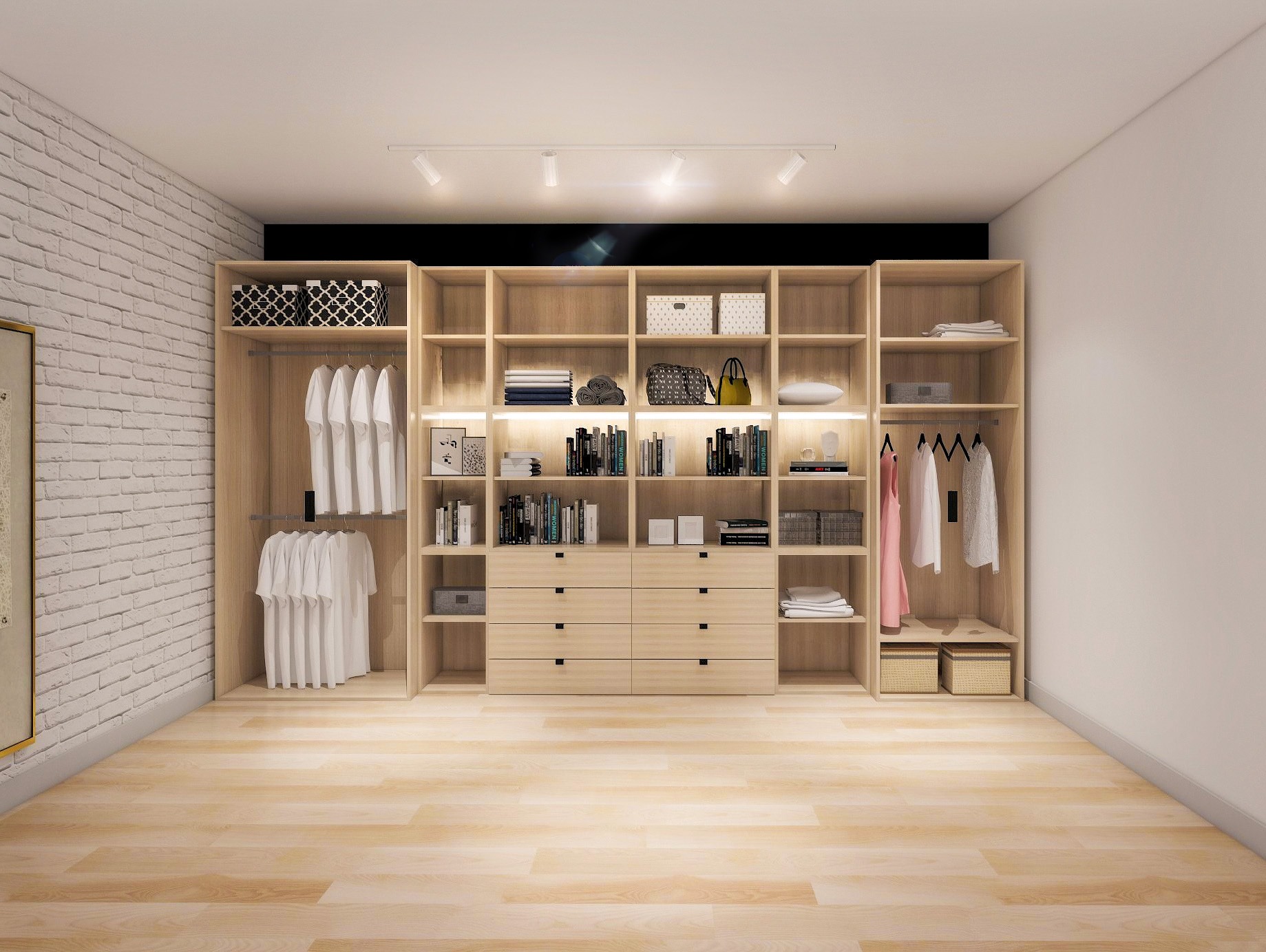 Jasne, drewniane wnętrze garderoby z oświetleniem punktowym, książkami i ubraniami. Biała ceglana ściana po lewej stronie dodaje tekstury.