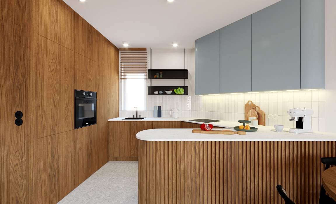 Stylowa kuchnia z drewnianymi frontami szafek i półwyspem wykończonym ryflowanym drewnem. Blat z białego kamienia, błękitne szafki wiszące i czarne dodatki.