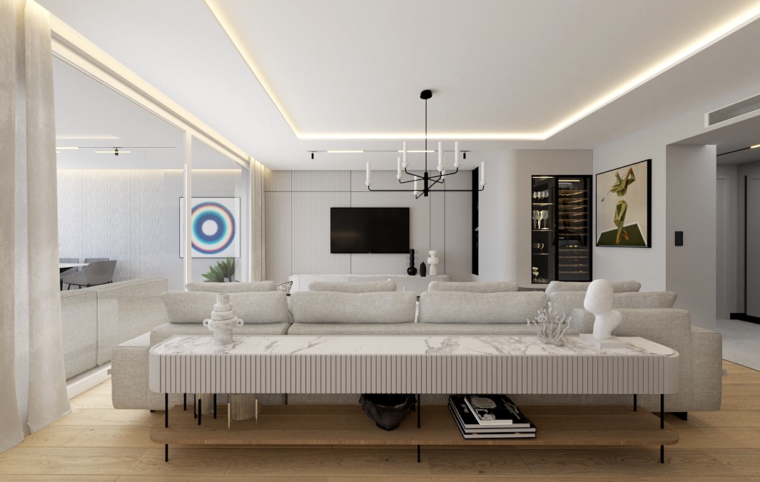 Jasny salon z szarą sofą, stolikiem z marmurowym blatem i minimalistycznym oświetleniem. Na ścianie telewizor i obraz. Widoczna przeszklona ściana z widokiem na jadalnię.