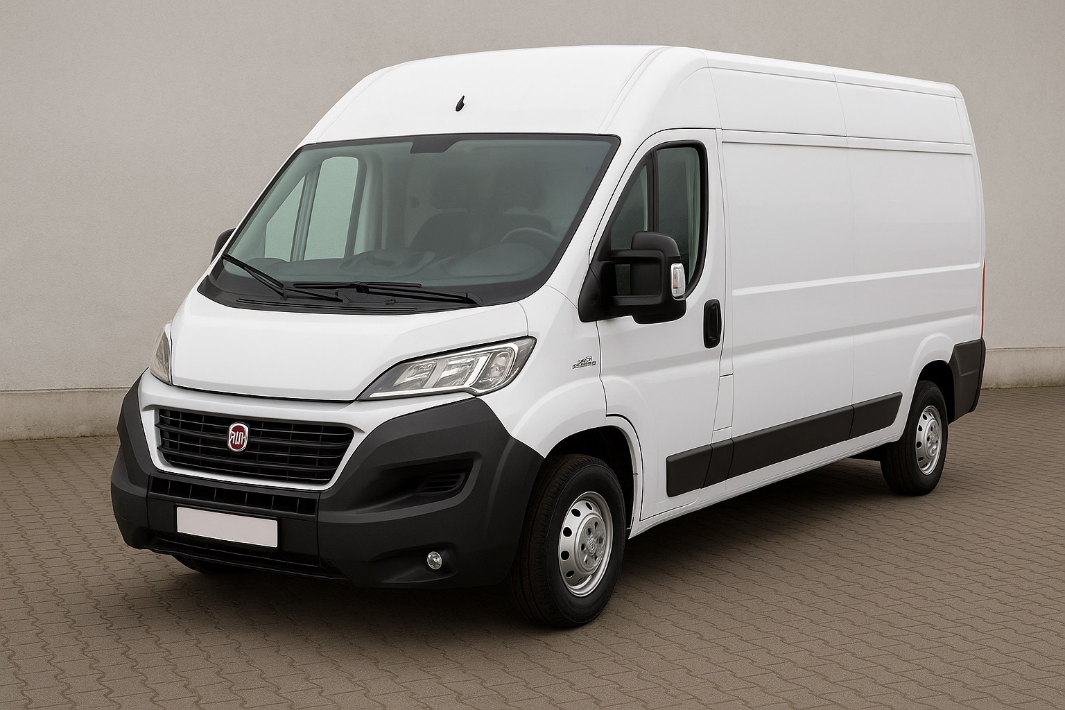 Biały samochód dostawczy Fiat Ducato na kostce brukowej, z widocznym logo marki na grillu. Auto gotowe do transportu, idealne do przeprowadzek.