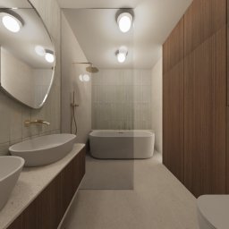 RINNOVO Usługi Budowlano Wykończeniowe Łukasz Bańcerowsk & Dash.Interior - Nowoczesna łazienka z owalnym lustrem, dwoma umywalkami na blacie z terazzo, wanną i drewnianą zabudową. Subtelne oświetlenie podkreśla minimalistyczny design.