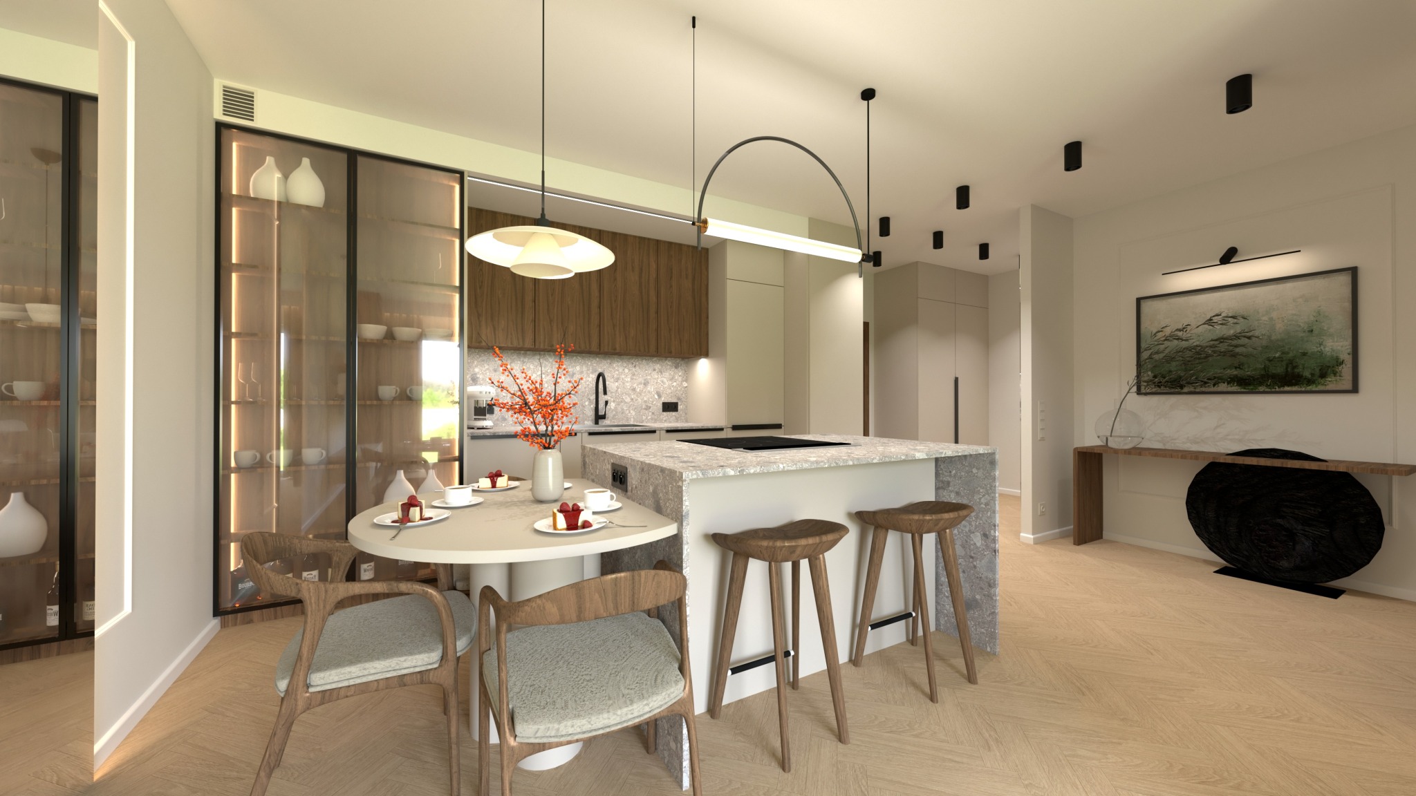 Elegancka kuchnia z wyspą, okrągłym stołem i drewnianymi krzesłami. W tle przeszklona szafa z dekoracyjną zastawą. Parkiet w jodełkę i nowoczesne oświetlenie.