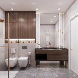 vizualemotion.pl-Iwanowicz Adam - Nowoczesna łazienka z kabiną prysznicową w kolorze złota, umywalką z szafką z ciemnego drewna i szarą płytką podłogową. Minimalistyczny design.