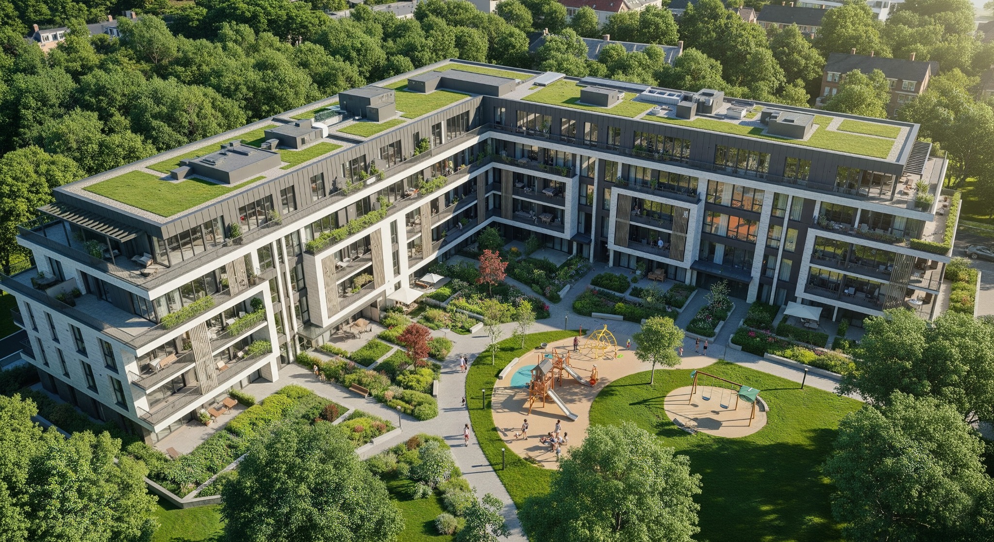Wysoki kąt: Nowoczesny apartamentowiec z zielonym dachem, balkonami i dziedzińcem z placem zabaw, otoczony drzewami. Architektura budynku z elementami bieli i szarości.