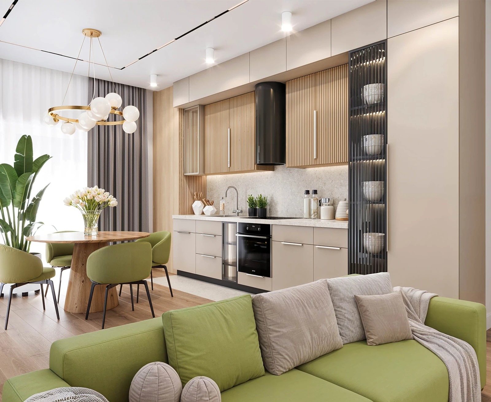Stylowa aranżacja wnętrza: kuchnia z jadalnią w odcieniach beżu i zieleni, z drewnianymi akcentami i nowoczesnym oświetleniem. Widoczny fragment sofy.