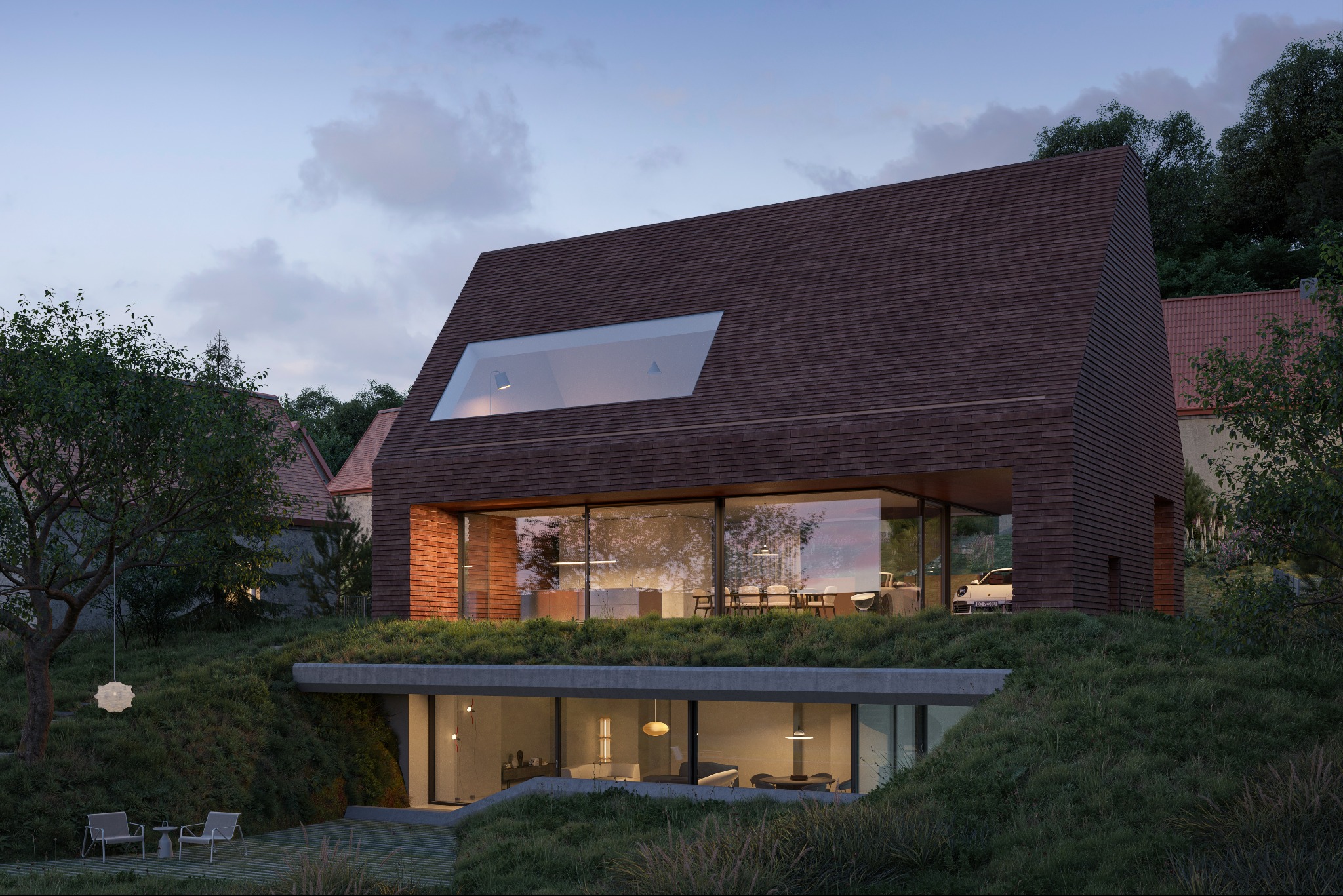 Nowoczesny dom z dachem krytym brązową dachówką, częściowo wkomponowany w zielony pagórek. Duże przeszklenia, minimalistyczny design, oświetlenie wieczorne.