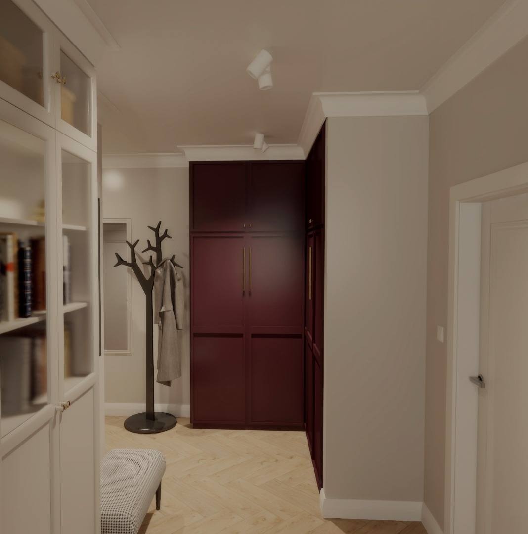 Stylowy przedpokój z burgundową szafą w zabudowie, oryginalnym wieszakiem na ubrania w kształcie drzewa i białym regałem z przeszkleniami. Parkiet ułożony w jodełkę.