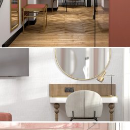 WIZUALIZACJE, ANIMACJE, KONCEPCJE - Wnętrze pokoju hotelowego w kamienicy: łóżko z dekoracyjnymi poduszkami, toaletka z okrągłym lustrem i krzesłem, parkiet ułożony w jodełkę, całość w ciepłej, stonowanej kolorystyce.