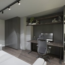 Design Atelier by Maria Słodowska - Nowoczesny pokój z biurkiem, krzesłem, sofą i minimalistycznym oświetleniem. Szafa wnękowa i półki z dekoracjami dopełniają aranżację. Stonowana kolorystyka.