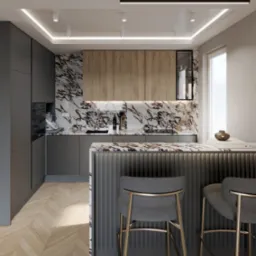 Nowoczesna kuchnia z marmurowym blatem, szarymi szafkami i drewnianymi akcentami. Dwa krzesła barowe z metalowymi nogami. Parkiet w jodełkę i oświetlenie LED.
