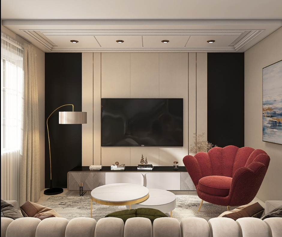 Elegancki salon z telewizorem, czerwonym fotelem w kształcie muszli i nowoczesnym oświetleniem. Minimalistyczny design z akcentami złota i czerni.