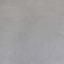 LOFTDEKOR SPÓŁKA Z OGRANICZONĄ ODPOWIEDZIALNOŚCIĄ - Jasnoszara, gładka powierzchnia posadzki z subtelnymi, ciemniejszymi przetarciami. Widoczna faktura materiału. Ujęcie z góry, bez widocznych elementów otoczenia.