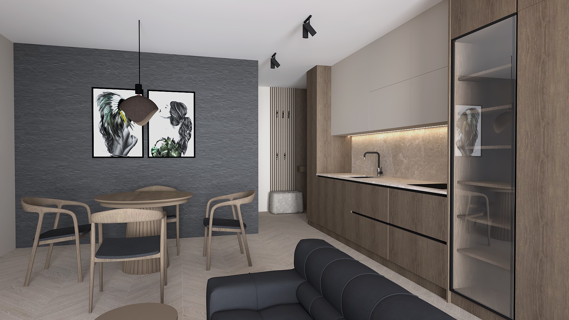 Nowoczesna aranżacja wnętrza: drewniana kuchnia z oświetleniem LED, stół z krzesłami i czarna sofa. Na ścianie grafiki w czarnych ramach.