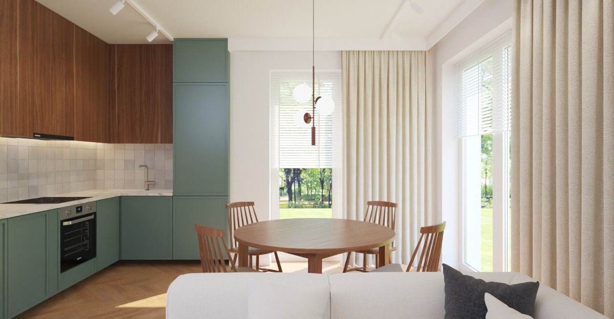 Nowoczesna kuchnia z jadalnią w odcieniach zieleni i drewna w Warszawie. Okrągły stół i krzesła z drewna, minimalistyczne oświetlenie.