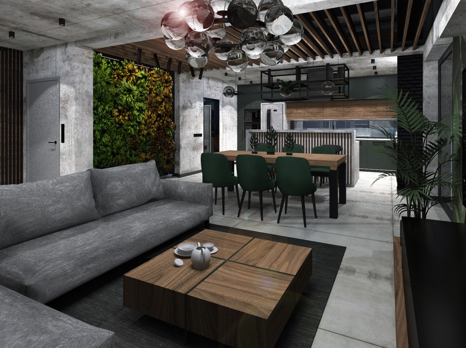 Nowoczesny salon z zieloną ścianą, szarą sofą i drewnianym stolikiem kawowym. Widoczna kuchnia w tle, oświetlona lampą w stylu industrialnym.