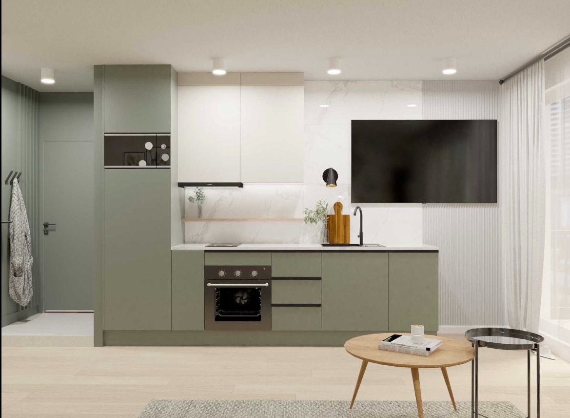 Nowoczesna kuchnia w odcieniach zieleni i bieli z drewnianymi akcentami. Minimalistyczny design, funkcjonalne rozwiązania i subtelne oświetlenie.