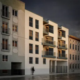 Nowoczesny budynek wielorodzinny z balkonami i dużymi oknami, kontrastujący z sąsiednią, starszą zabudową w pochmurny dzień. Minimalistyczna architektura.