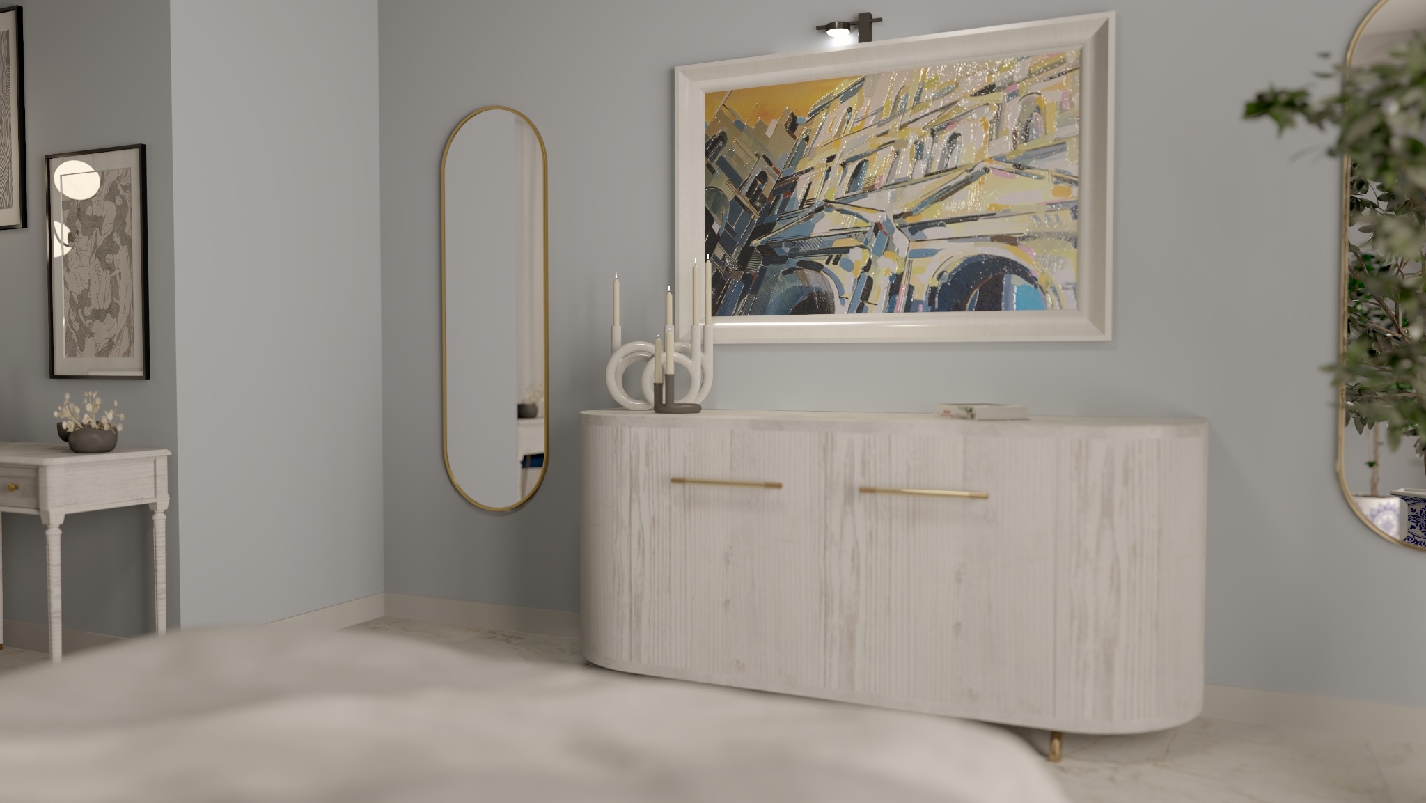 Jasne wnętrze sypialni z owalnym lustrem w złotej ramie, komodą z obrazem i dekoracjami. Stonowana kolorystyka ścian i podłogi tworzy przytulną atmosferę.