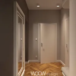 Nowoczesny korytarz z parkietem w jodełkę, lustrem w białej ramie i półkami z książkami. Minimalistyczny design, ciepłe oświetlenie, stonowana kolorystyka.