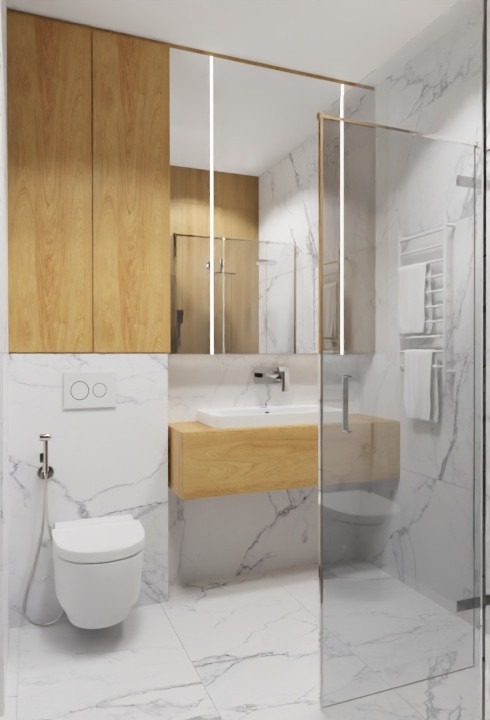 Nowoczesna łazienka z marmurowymi płytkami, drewnianymi szafkami i szklaną kabiną prysznicową. Minimalistyczny design z subtelnym oświetleniem LED.
