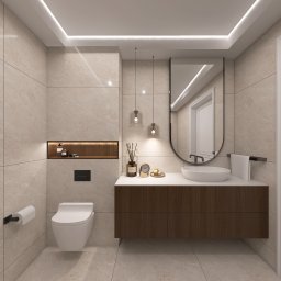 MadLine Studio - Elegancka łazienka z beżowymi płytkami, wiszącą szafką z umywalką, lustrem w czarnej ramie i subtelnym oświetleniem LED. Minimalistyczny design, ciepłe barwy.